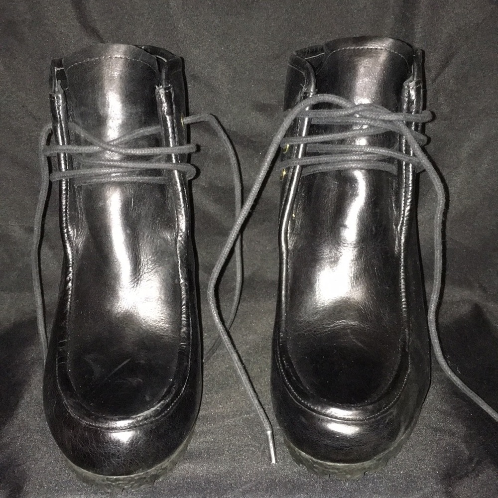 Michael Kor’s black leather wedge booties